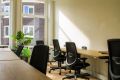 Here's an example of one of our offices with movable chairs for sitting and standing and some ergonomic office chairs