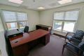 This office for two has natural light from the operable windows and comes fully furnished, including two full-sized desks, one with an Ergotron sit-stand desk.  Access to full kitchen, conference room and work room with all necessities included (WiFi & copier).  Onsite UPS and FedEx pickup boxes.