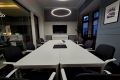 Equipped with a high-quality TV for seamless presentations and video conferencing. AI Professional Camera & Microphone Setup
