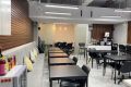 Couch seating at the main area for coworking. 

Kyodo Amenities include: 

🛜 Access to Wifi
🔌 Sockets
☕ Unlimited Coffee/ Tea/ Water/ Juice
🍴 Pantry 
🗄️ Locker Use
🧻 Clean CR (with bidet)
