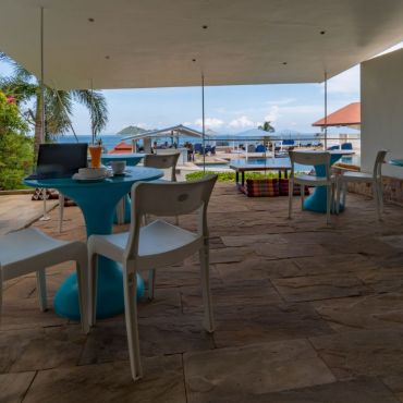 Our patio overlooks the pool and is perfect to take a break or have some food and drinks.