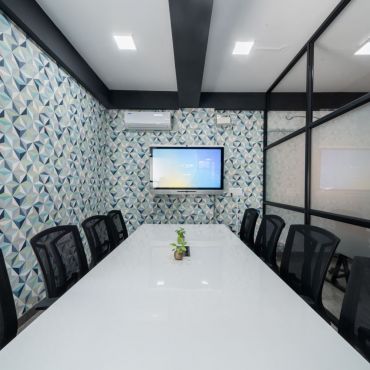 Conference room with premium setup and interactive display.