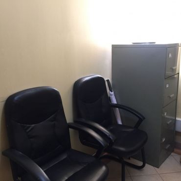 Waiting seats and filing cabinet