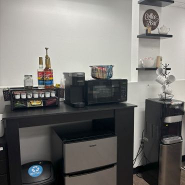mini coffee bar with fridge and microwave