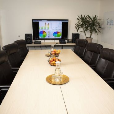 Conference room can fit between 8 and 10 comfortably around a reconfigurable table. Conference room comes equipped with a 70” HD monitor and Dolby Sound.