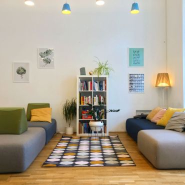 Lounge on our custom-made couch and flip through a book as a break