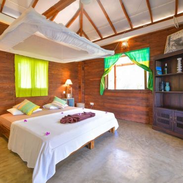 Sleep well in our private AC bungalows set in beautiful gardens and jungle